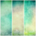 Abstract green background banners or striped designs in soft mottled white and beige watercolor grunge texture stains