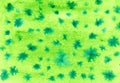 Abstract green background with stars. Color splashing on paper. Aquarelle texture. Handmade original wallpaper Royalty Free Stock Photo