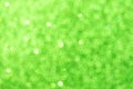 Abstract green blurred bokeh background. Glitter shining lights. Festive and celebration backdrop for holiday, christmas Royalty Free Stock Photo