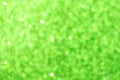 Abstract green blurred bokeh background. Glitter shining lights. Festive and celebration backdrop for holiday, christmas Royalty Free Stock Photo