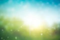 Abstract green bokeh blurred gradient in spring morning garden background Earth day concept: sun light meadow and blue sky on Royalty Free Stock Photo