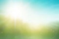 Abstract green bokeh blurred gradient in spring morning garden background Earth day concept: sun light meadow and blue sky on Royalty Free Stock Photo