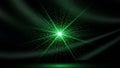 Abstract green light explosion with glowing particles and rays on a dark background Royalty Free Stock Photo