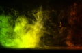 Abstract green,orange and yellow Colorful smoke on a black background. Royalty Free Stock Photo