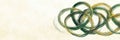 Abstract green and yellow interlocking circles on textured light background Royalty Free Stock Photo