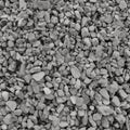 Abstract grey and beige gravel stone background, crushed gray stones and granite pieces texture, large detailed textured rough Royalty Free Stock Photo