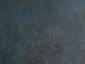 Abstract Grunge Decorative Dark Blue Grey stucco Wall Background. Gloomy Rough Smear Texture. Web Banner or Wallpaper