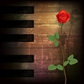 Abstract grunge piano background with red rose Royalty Free Stock Photo