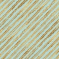 Abstract grunge seamless pattern with golden glittering acrylic paint diagonal stripes on pastel green background Royalty Free Stock Photo