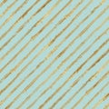 Abstract grunge seamless pattern with golden glittering acrylic paint diagonal stripes on pastel green background Royalty Free Stock Photo