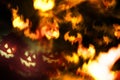 Abstract halloween background, scary faces and fire bats