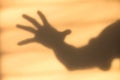 Abstract hand shadow on the wall. Royalty Free Stock Photo