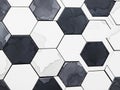 Abstract hexagonal pattern of black and white tiles with subtle texture Royalty Free Stock Photo