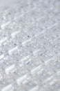 Abstract high-tech background. A sheet of transparent plastic or glass with the cut out holes. Laser cutting of Royalty Free Stock Photo