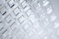 Abstract high-tech background. A sheet of transparent plastic or glass with the cut out holes. Laser cutting of Royalty Free Stock Photo