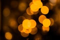 Abstract holiday background, beautiful shiny Christmas lights, glowing magic bokeh.Defocused lights abstract background.Gold Royalty Free Stock Photo