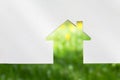 Abstract house on green grass. Eco house. Copy space Royalty Free Stock Photo