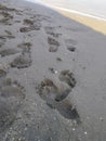 abstract human footprints on the beach Royalty Free Stock Photo