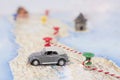 Abstract idea of rent a car. Small car on map. Abstract travel photo Royalty Free Stock Photo