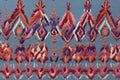 abstract Ikat embroidery pastel color pattern tribal with geometric white lines red, purple, pink stripes on blue background