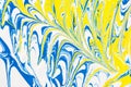 Abstract illustration of a combination of blue and yellow colors on a white based, chaotic pattern of straight and sinuous lines