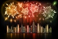 Fireworks exploding in night sky over downtown city with reflection in water in orange, red and green shades Royalty Free Stock Photo