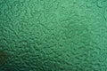 Abstract illustration. Ice or raindrops close up. Macro, strong magnification. The background is green