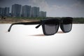 Abstract illustrations meaning the vision of leader by the image of the sunglasses and tall building construction and city