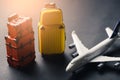 The abstract image of the airplane and luggage model laying on the table. the concept of travel, business, aircraft, international