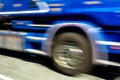 Abstract image of a blue speeding truck with a strong motion blur effect Royalty Free Stock Photo