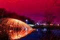 Abstract Image of Burning Wirewool being used to make circle like light trails at Night Royalty Free Stock Photo