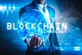 The abstract image of the business man hold the blockchain hologram on hand and element of this image furnished by Nasa.