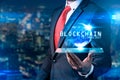 The abstract image of the business man hold the blockchain hologram on hand and element of this image furnished by Nasa. the conce