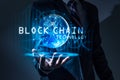 The abstract image of the business man hold the blockchain hologram on hand and element of this image furnished by Nasa.