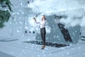 Abstract image of business woman with augmented reality glasses standing on laptop keyboard on desktop workplace with clouds. Royalty Free Stock Photo