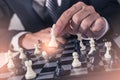 The abstract image of the businessman take a checkmate on the chess board during the games