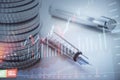 Abstract image of coin stack, pen and candlestick forex chart on blurry desktop backdrop. Trade, money and financial growth Royalty Free Stock Photo