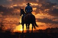 Abstract image of cowboy riding on a horse against colorful sunset sky. Silhouette of rider in cowboy.