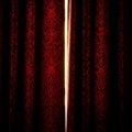 Dramatic Red Velvet Curtains with Golden Light Crevice Royalty Free Stock Photo
