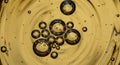 Cluster of various-sized bubbles suspended in a golden liquid Royalty Free Stock Photo