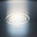 Abstract image featuring concentric circular light reflections or ripp Royalty Free Stock Photo