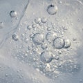 Abstract image featuring numerous air bubbles trapped in a translucent medium, potentially ice or Royalty Free Stock Photo