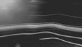 Abstract black and white image featuring streaks of light across a dark background Royalty Free Stock Photo