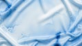 Abstract image with a flowing fabric-like texture in soft blue and white Royalty Free Stock Photo