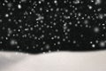 abstract image of flying snow over black background, winter season. Royalty Free Stock Photo