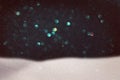 abstract image of flying snow over black background, winter season. Royalty Free Stock Photo