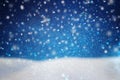 abstract image of flying snow over dark blue background, winter season. Royalty Free Stock Photo