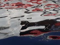 abstract image formed by reflection of a boat on river water