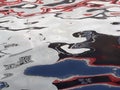 abstract image formed by reflection of a boat on river water