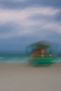 abstract image of a green lifeguard tower on the beach